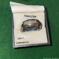Ring shown in its box labeled 'TUNGSTEN', with size 11 and comfort fit indication.
