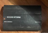 Top view of Sound Storm SSL1020X amplifier showing branding, model number, and power rating.