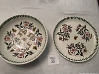 Both large bowl and serving platter side by side showing size and decorative details