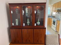 Front view of assembled Brazilian rosewood buffet and hutch.