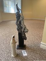 Both figures side by side on carpet, showing relative size and details.