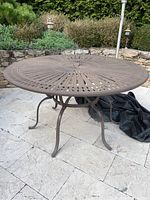 Overall view of round table on stone patio