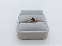 Front view of ring in grey display box