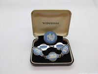 Bracelet and brooch displayed in black velvet-lined Wedgwood box