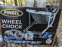 Original product box showing Pingel branding and front wheel chock image.
