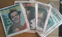 Four issues of Rolling Stone magazine from 1974-75 with visible covers of Jack Nicholson, Linda Ronstadt, George Harrison and The Beatles.