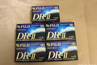 Front view of five sealed Fuji DR-II High Bias 90 Minute cassette tapes showing brand and product details.