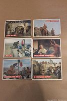 Six Davy Crockett orange back cards laid on a flat surface showing front scenes with titles