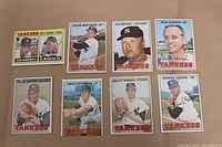 Eight 1967 Topps New York Yankees baseball cards laid out, showing front with player images and names.