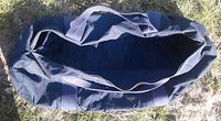Open top view of a navy blue heavy duty canvas duffel bag with inner lining shown.
