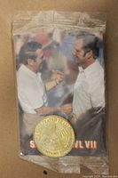 Front of sealed commemorative card showing Don Shula and George Allen with coin attached.