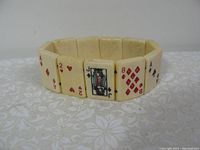 Image showing the bracelet with playing card designs including Ace of Diamonds, 2 of Hearts, Jack of Spades, 8 of Diamonds, and Ace of Clubs.