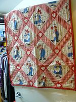Full view of vintage Raggedy Ann quilt cover with checkered diamond pattern and heart details