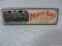 Cardboard box of M. Hohner Marine Band harmonica showing the vintage Marine Band image and branding information No. 1896