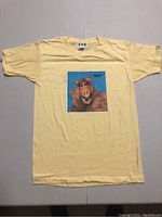 Full front view of yellow T-shirt with Alf graphic