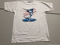 Front view of white vintage Bermuda T-shirt with marlin and 'BERMUDA' graphic centered on the chest.