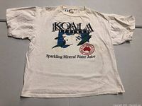 White vintage Koala Springs T-shirt laid flat showing front full view with logo and text print.