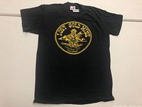 Front view of a black vintage T-shirt with yellow circular graphic featuring a prospector and text 'Lost Gold Mine Central City Colorado'.