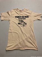 Front view of beige vintage T-shirt with 'Pointe Du Bois Manitoba' and fish graphic shown fully