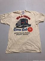 Full view of the back of the vintage truck stop T-shirt showing the graphic print of a large truck and text.