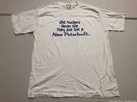 Front view of white T-shirt with blue printed slogan text