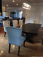 Set of chairs arranged around dining table