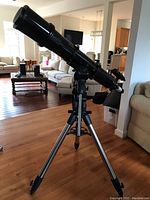 Full assembled telescope on tripod in living room