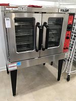 Front view of stainless steel convection oven on legs