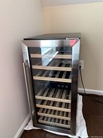 Front view of closed cooler showing full stainless steel and glass door