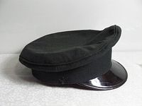 Photo of the black Canadian Forces service cap showing overall shape and visor.