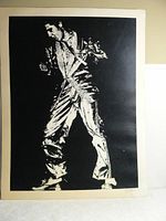 Full view of large black and white Elvis Presley poster featuring dynamic full body pose
