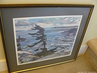 Full view of framed reproduction artwork depicting a tree and body of water.