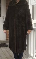 Full front view of mink coat on mannequin