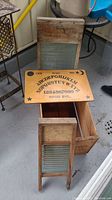 Washboard wooden crate with Ouija board and two washboards in a group