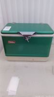 Full frontal view of green Coleman cooler showing overall shape and color.