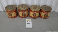 Front view of all four Sumas Fine Cut tobacco tins in a row