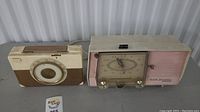 Photo of both the vintage RCA Victor clock radio and portable radio side by side showing overall condition and details.
