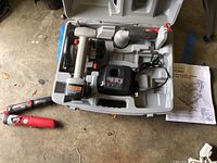 Craftsman cordless saw and charger in plastic carrying case with instruction manual