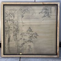 Front view of framed Chinese ink painting print showing trees and frame with stains.