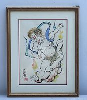 Full view of the framed Japanese demon painting showing the composition and colors used.