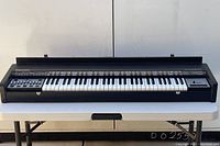 Front angled view of Hohner String Performer keyboard on table
