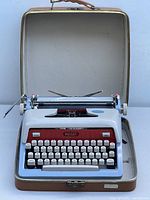 Front view of the Royal Future 800 typewriter sitting open in its carrying case, showing the keyboard and paper holders.