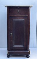 Front view of the Victorian wooden side cabinet with a marble top, showing single door and round knob drawer above.