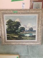 Overall view of framed painting showing composition and frame