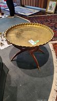 Full view of side table showing removable brass top and wooden base