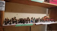 Shelf display of all metal toy soldiers, cavalry and accessories