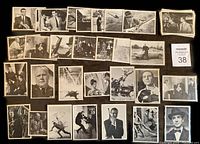 Layout of 33 black and white 1965 James Bond 007 collectible trading cards arranged in rows showing various movie scenes and character images.