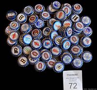 Photo of the full set of 85 NHL Stanley Cup Champions Labatt Blue bottle caps showing various team logos and years.