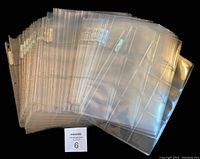 Lot of 45 new unused Ultra Pro Platinum 9-card collector sheets stacked showing clarity and binding edge.