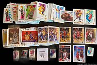 Overview of a large stack of basketball cards featuring Michael Jordan, Magic Johnson, and other NBA stars, with colorful and action-packed card designs.